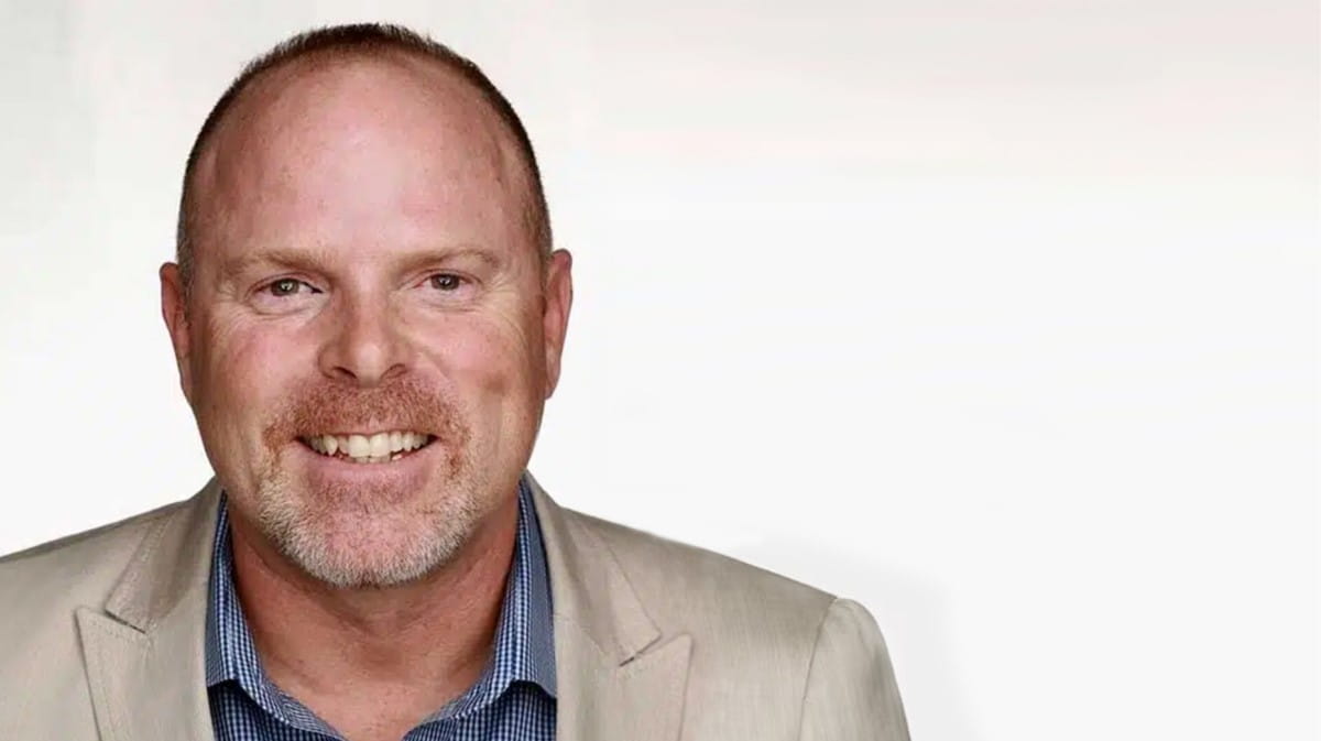 Portrait of Rob Williams, dressed in a formal attire.