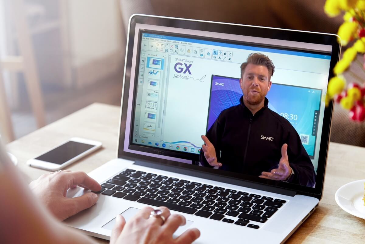 Professional demonstrating the features of a SMART product in an educational session.